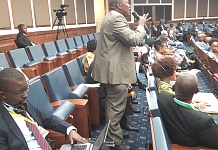 Hon Kasamba Mathias contributes to the debate at the Symposium yesterday