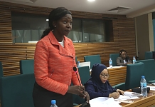 Hon Susan Nakawuki, mover of the Motion for a Resolution urging the Council of Ministers to direct Partner States to remit their finances addresses the House