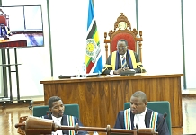 Speaker of EALA, Rt Hon Ngoga K. Martin and the Clerks at table, Charles Kadonya (left) and Victor Manzi (right) pay attention to the proceedings
