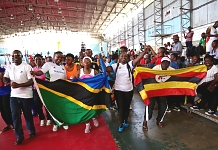 POMP AND COLOUR: Legislators and fans in a joyous mood at the Indoor Stadium in Dar