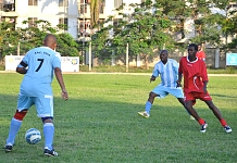 Captain of EALA, Hon Straton Ndikuryayo (back against camera) controls the ball as a Parliament of Burundi opponent approaches