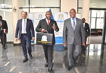 EA 2.jpg: The Chief Administrative Secretary in the Ministry of EAC, Kenya, Hon. Ken Obura, holds the briefcase containing the 2021/2022 budget speech as he heads to the East African Legislative Assembly Chambers in Arusha, Tanzania.