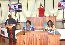 Lawrence Kamugisha, former Legislative Draftsman, EAC engaging with Members during the induction workshop in Arusha