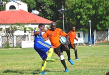 Action in the match between Parliament of Burundi (in red) and Parliament of Tanzania