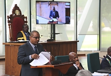 Hon Abdikadir Aden, Chairperson of the General Purpose Committee reads the report of the Committee before an attentive House