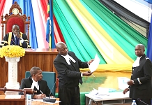 The Clerk, EALA, Kenneth Madete (centre) scrutinizes a vote as Principal Clerk Assistant, Charles Kadonya (seated) and Serjeant-at-Arms, Ezekiel Migosi looks on