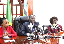 EALA Speaker Hon. Ngoga K. Martin (center), speaking at the press conference. He is flanked by Hon. Nkuhi Fancy Haji (left) and Hon. Dr. Anne Leornardo Itto (right).