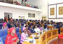 A section of Members (downstairs) and the Visitors (Upstairs) pay attention to the Proceedings of the Assembly