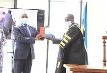 IMG 8405: Secretary General Hon. (Dr.) Peter Mathuki receives working instruments from the Speaker of EALA Rt. Hon Martin Ngoga