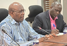 Speaker of the East African Legislative Assembly (EALA), Rt. Hon. Joseph Ntakirutimana chairing the commission meeting, flanked by Mr Alex Obatre, EALA Clerk