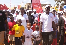 The Speaker of EALA, Rt Hon Daniel F. Kidega (right) accompanied by children lead the Irene Gleeson Foundation Charity Walk in Kitgum